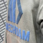 Raised logo pullover hoodie bulk production