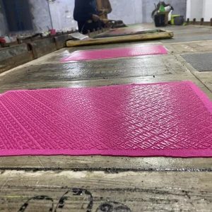 Pink printing screen containing repeated MECHDAM logo and text patterns